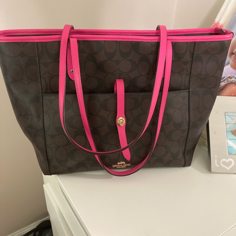 Coach bag slightly stain in the inside from ketchup.